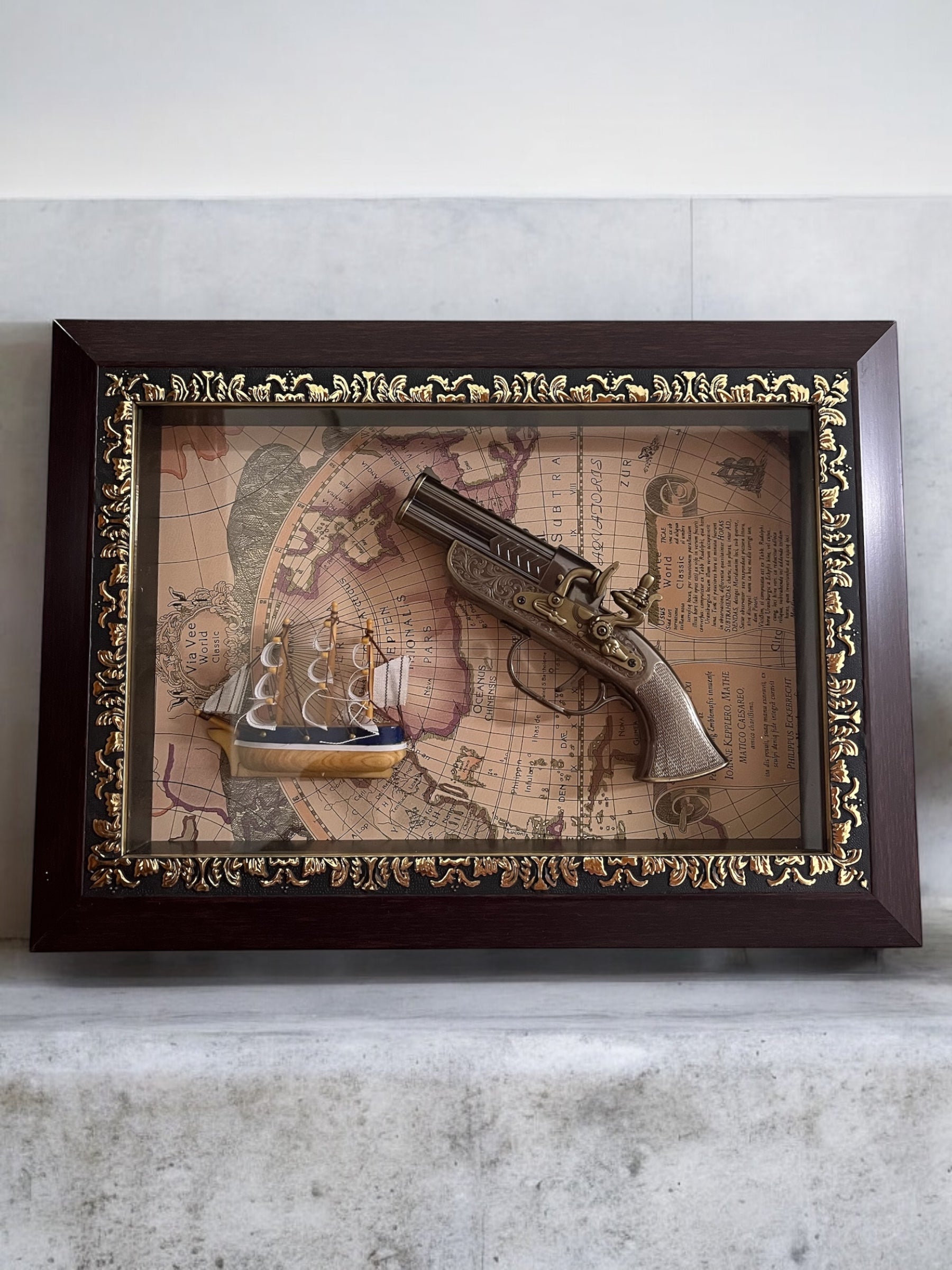 Vintage Decorative Collectible with Antique Pistol and Ship