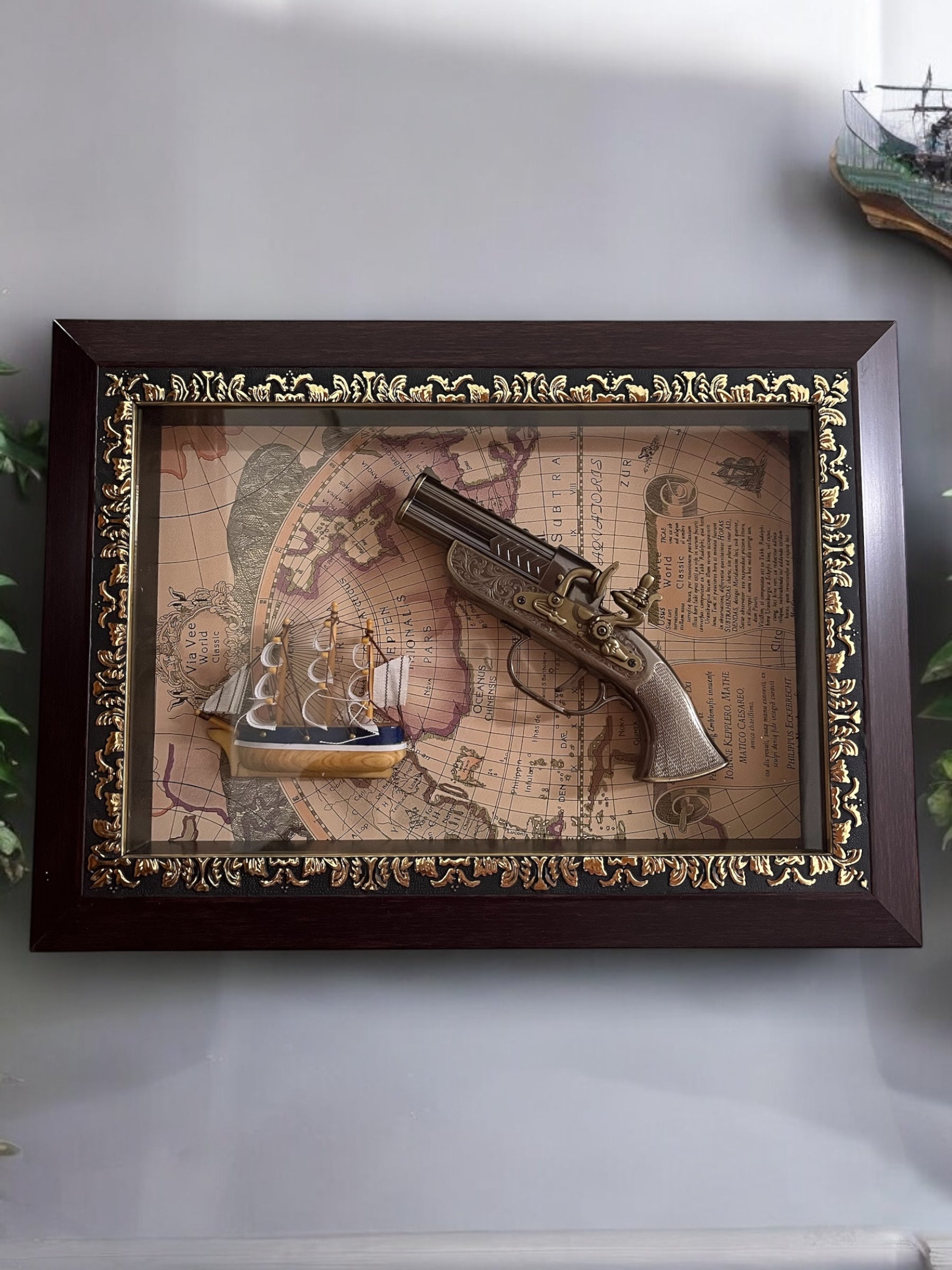 Vintage Decorative Collectible with Antique Pistol and Ship